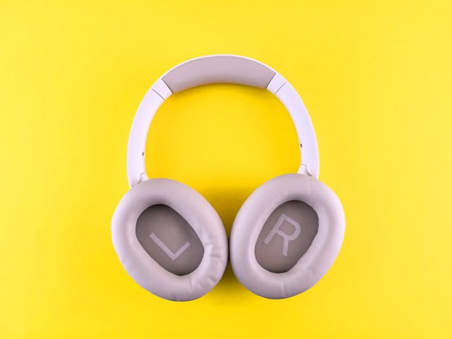 Best noise-canceling headphones: A pair of wireless headphones on a yellow background