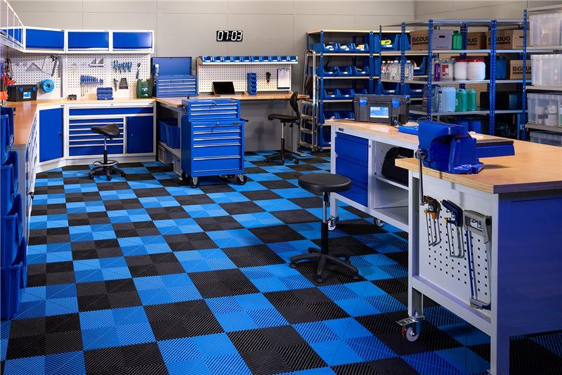 A workspace consisting of BiGDUG storage, flooring and shelving