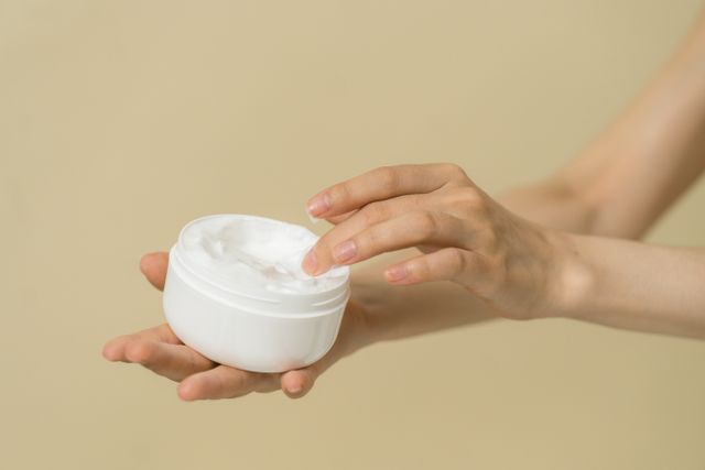 Best moisturiser for dry skin: A person taking moisturiser from a container