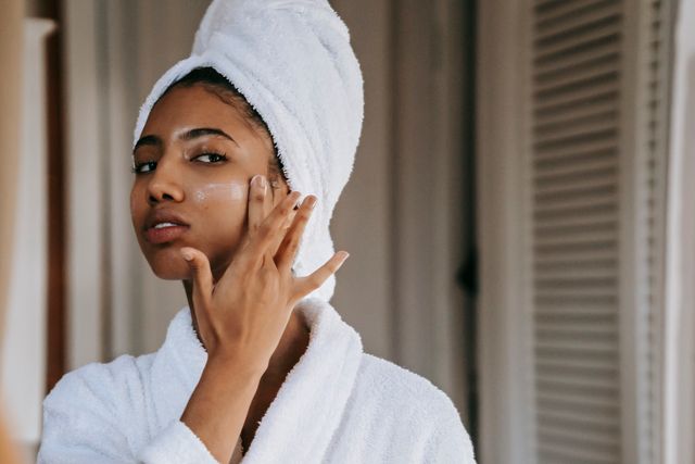 Basic skincare routine: A woman applying moisturiser on her face