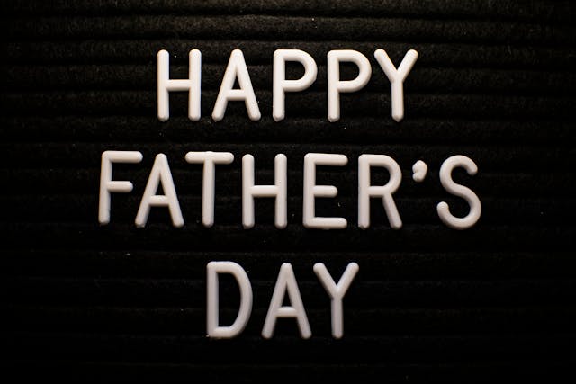 Father's Day gift ideas: “Happy Father’s Day” written out on a black surface