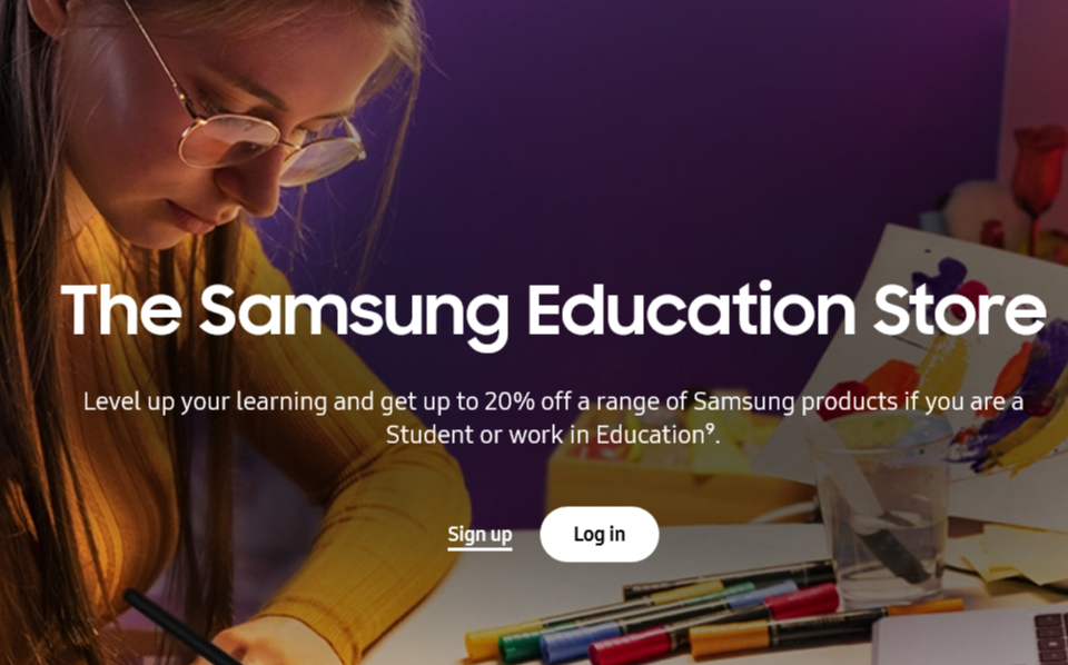 A student looking down at a desk with multiple colour pens, The Samsung education store written in white over the student.