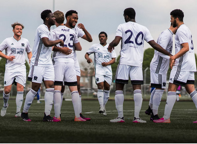 A football soccer team wearing kits from Pro Direct sport including the shoes