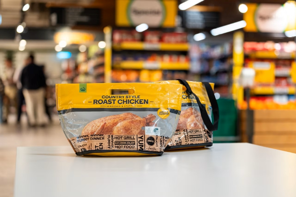 A Woolies Bachelor’s Handbag resting on a counter in a supermarket