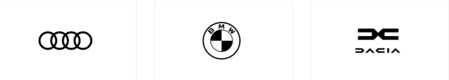 Die drei Logos der Automarken Audi, BMW and Dacia in Schwarz auf Weiß