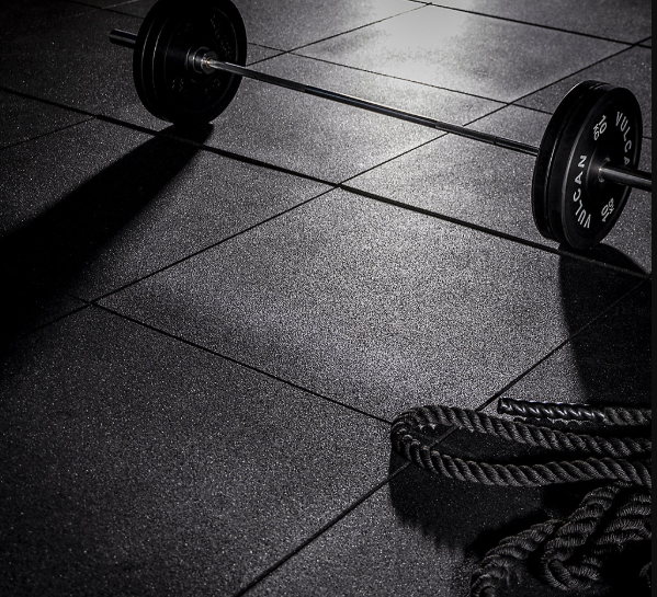 BiGDUG gym flooring: The BiGDUG Rubber Heavy Duty Gym Tiles with a weight on them