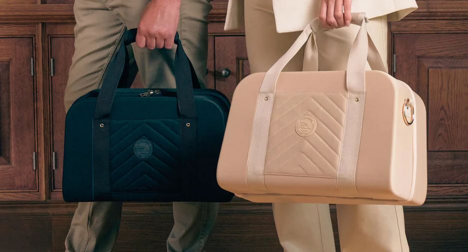 Cabin-Max-Cabin-Carry-On-Luggage-Travel-Bags carried by two people