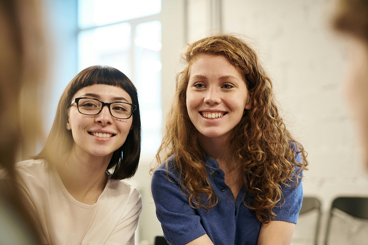 Image showing two students discussing Iberostar coupon codes.