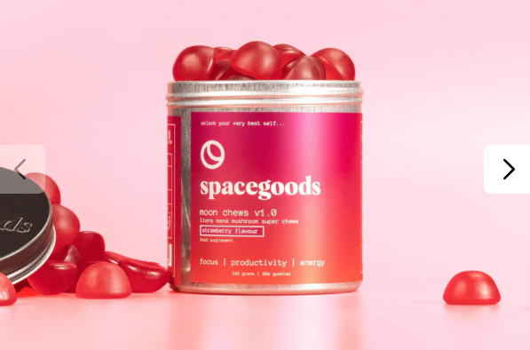 A pink tub of Space Goods strawberry-flavoured Moon Chews against a pink background.