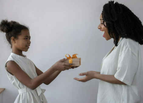 A girl giving her mother a present for Mother's Day
