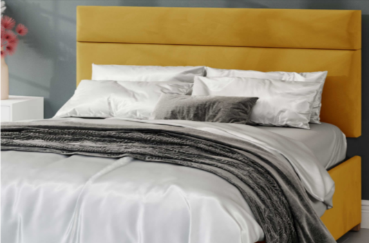 A yellow headboard and bed from Aspire Store