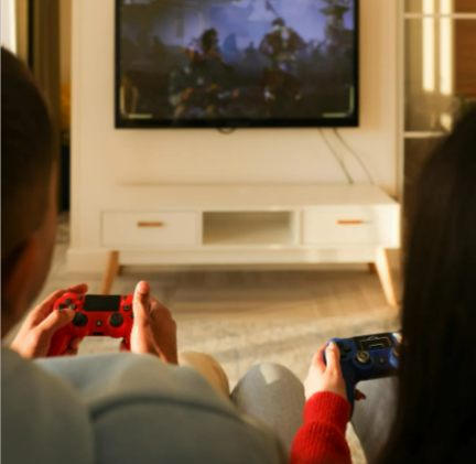 A couple playing video games in the living room