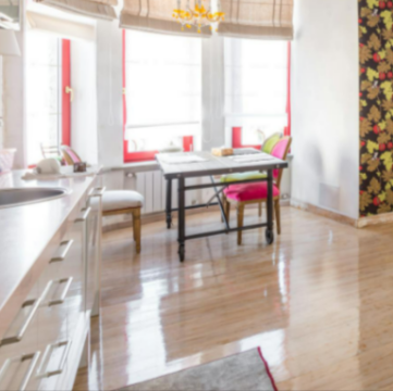 A spacious living room with wooden flooring