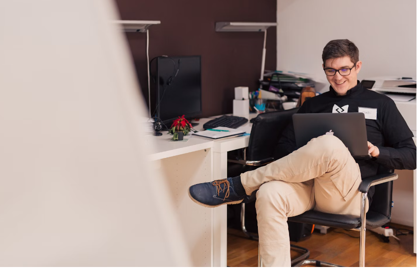 A male student browsing on his laptop for a Protein Works discount code
