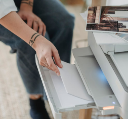 A person printing documents with ink from Ink Factory