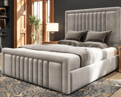 A greige headboard and bed base with neatly spreaded linen
