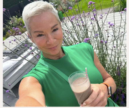 A lady holding her shake and taking charge of her health