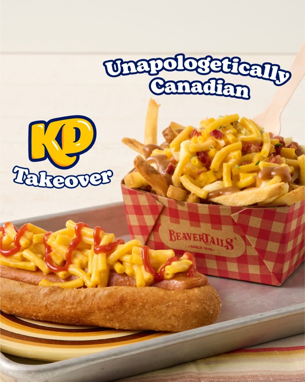 A KD Takeover Beaverdog and KD Takeover Poutine resting on a metal tray