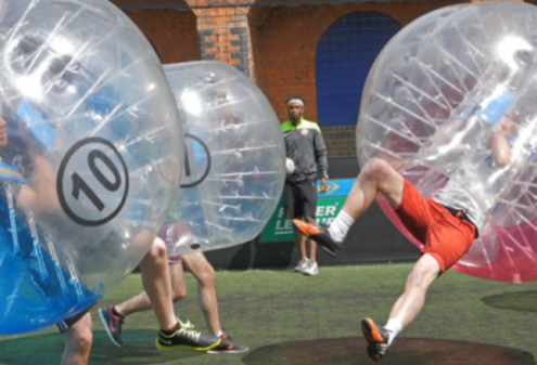 image showing people playing bubble football