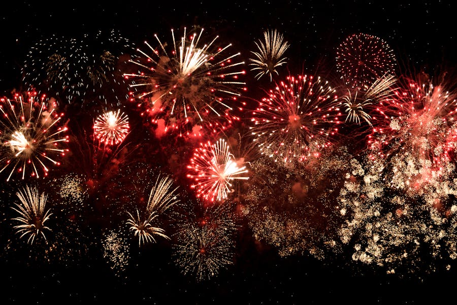 Red and gold fireworks that have been set off at night time
