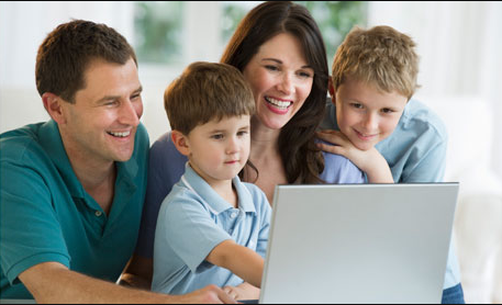 A family sits down and searches the internet for the best Mica Lighting promo code