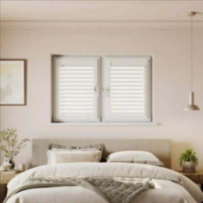 A bedroom with California Shutters