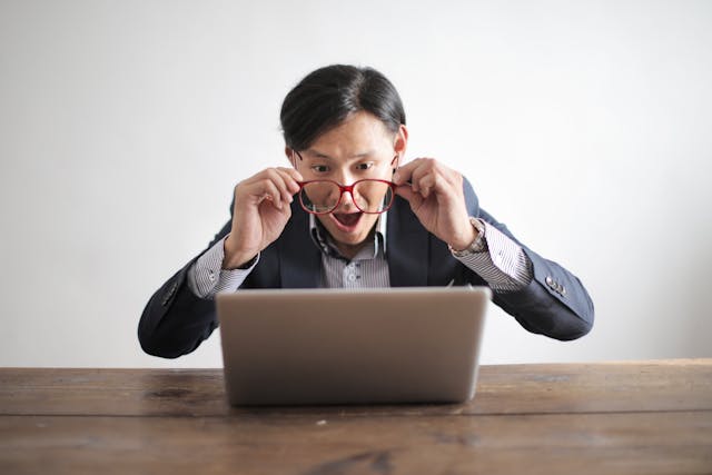 Man looking at a Adult promo code and the amazing deal he is going to get