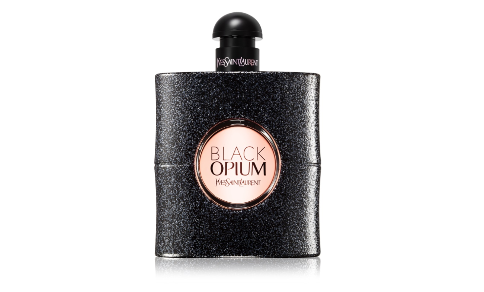 Speckled black bottle with a circular pink centre piece displaying the words ‘Black Opium Yves Saint Laurent’