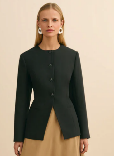 The ALIGNE Daphne waisted blazer in green paired with the Nola bubble hem skirt in camel colour