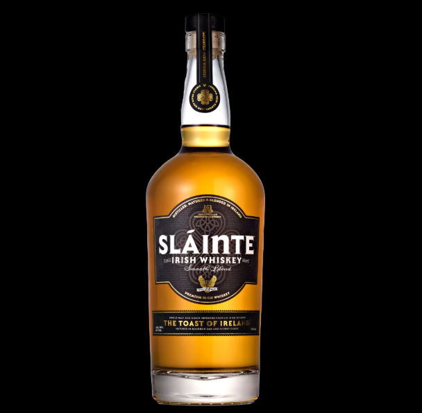 Things to do on St. Patrick's Day: A bottle of Slainte Irish Whiskey in front of a black background