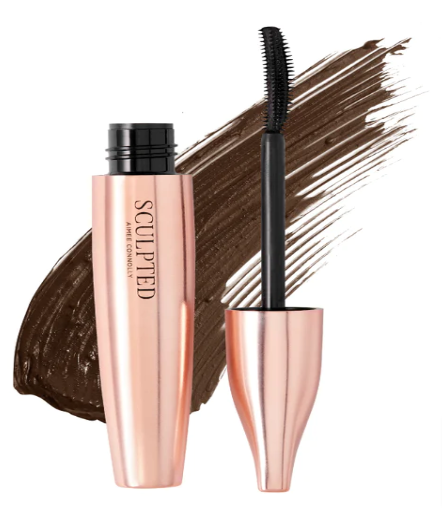 A pink  tube of Sculpted by Aimee mascara on top of its brown shade and its wand next to it