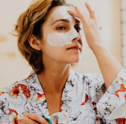 A woman doing her self care routine with a mask from Gillette