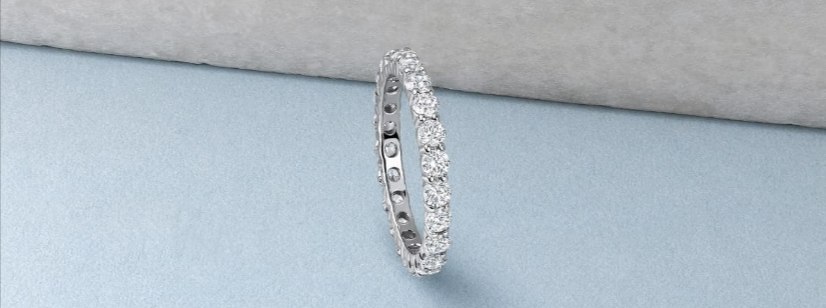 Full Diamond Eternity Rings from Purely Diamonds with a sky blue background