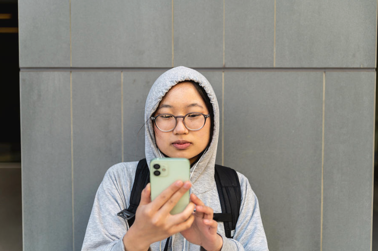Asian young woman looking for a Wayfair coupon