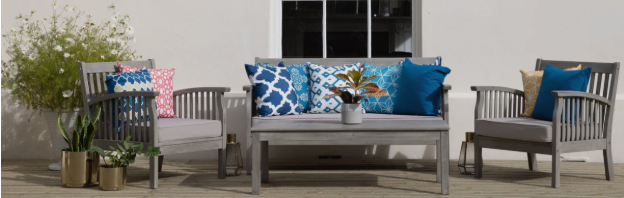 Grey wooden outdoor patio furniture set on a deck