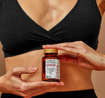 A lady holding the Gold Collagen Dermabiotix Immunobiotix tablets.