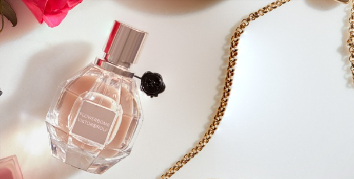 Flower Bomb by Viktor&Rolf perfume bottle on a white backgorund with a gold chain