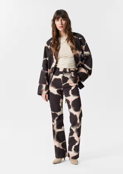 Wedding guest suits: A model wearing a kimono jacket and straight leg trousers