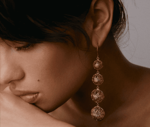 A model showcasing a piece of Freya Rose jewellery