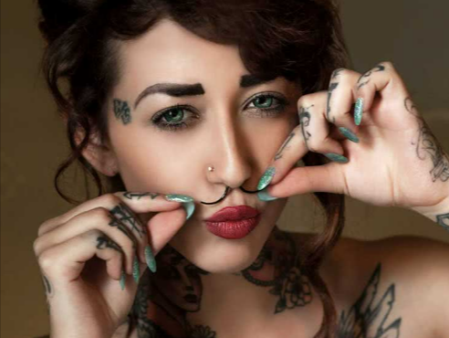 A lady flaunting her moustache inspired Crazy Factory septum piercing piece Crazy Factory important links