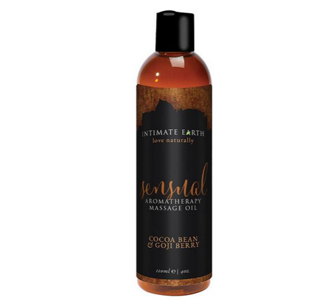 Intimate Earths' Sensual Cocoa Bean and Goji Berry Massage Oil is written on the sticker of an oil bottle with a black lid, and its contents brown.