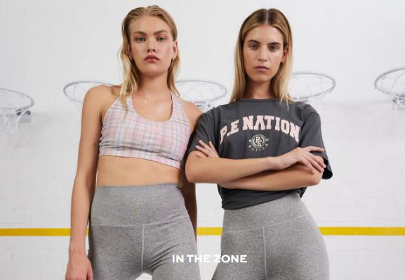 A picture of two women showing their sportswear cloth