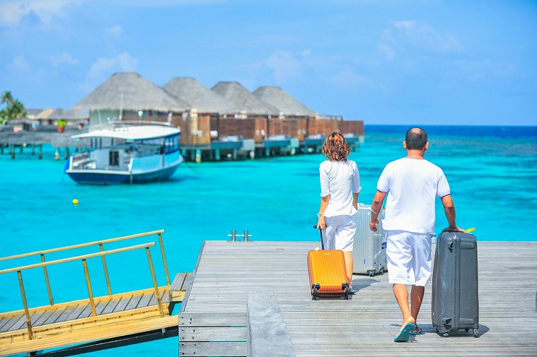 image showing two individuals heading to their holiday transportation.