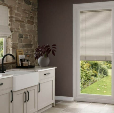 A kitchen with Blindsbypost blinds