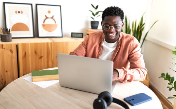 Student is happy seeing Emirates promo code on his laptop