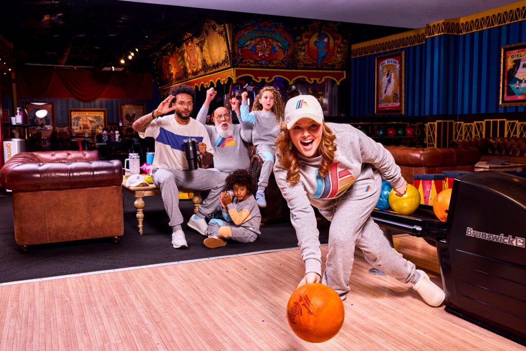 A family bowling while wearing ALDImania streetwear