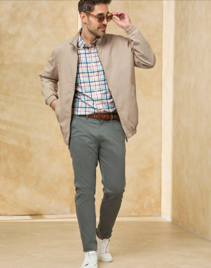 A man wearing a Cotton Traders washed twill harrington jacket