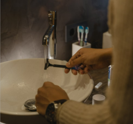 A man shaving with a razor from Gillette in a modern and stylish bathroom.