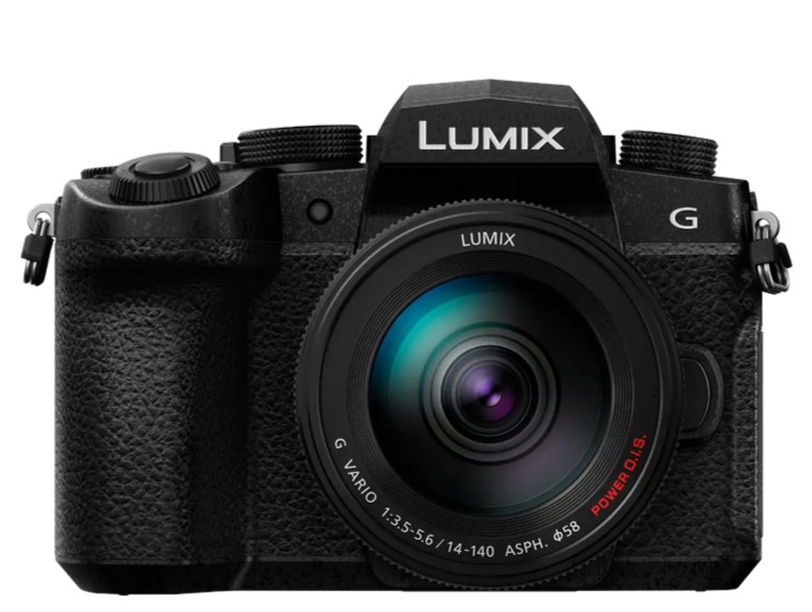 Black Panasonic Lumix camera with lens facing front and small white letters on it all on a white background