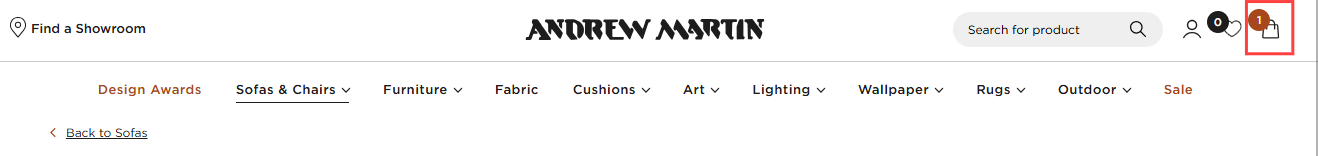 The Andrew Martin homepage with the shopping basket icon in a red box.